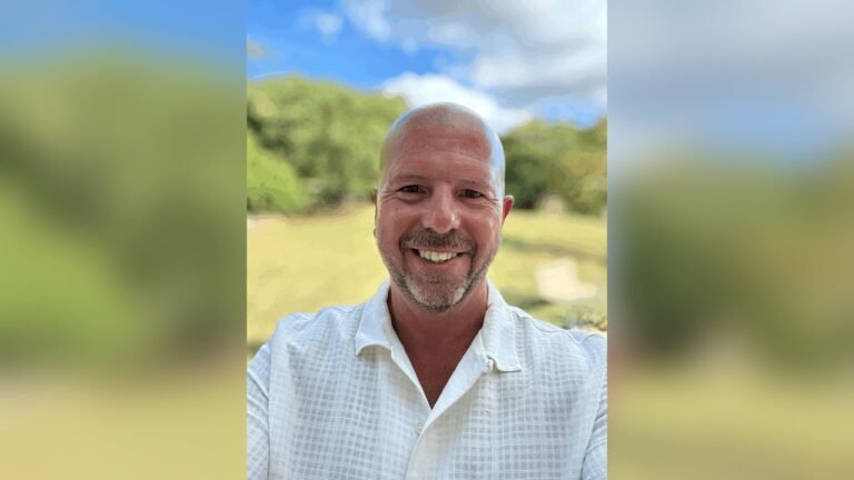 James Hartley outdoors, smiling