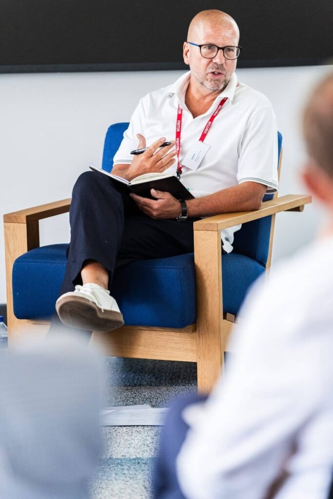 James Hartley in conversation during a coaching session